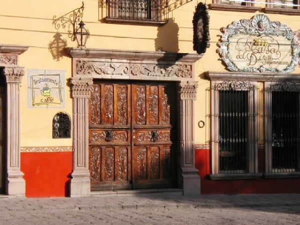 Wooden doors with cantera stone frames — a hallmark of San Miguel's colonial architecture